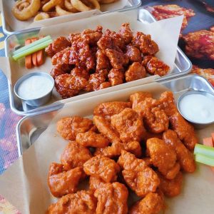 Buffalo Wild Wings sauce on wing trays